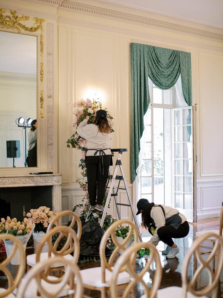 Abby Garden Floral Employee setting up flower arrangement