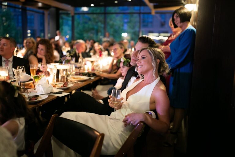 Bride and groom dinning with guest