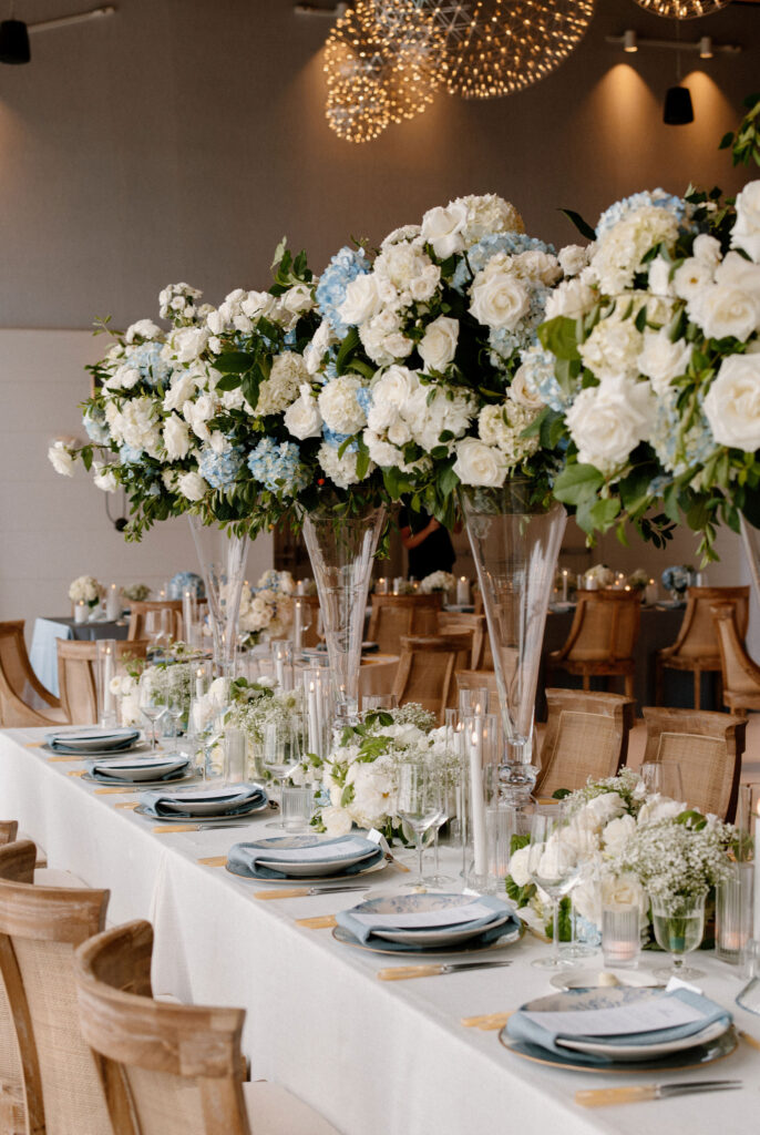 elevated floral arrangements above a dining table