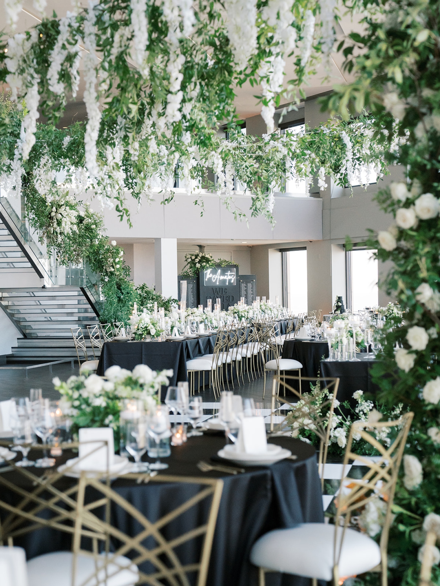 A large floral installation and hanging canopy of fresh flowers at a luxury wedding in Boston