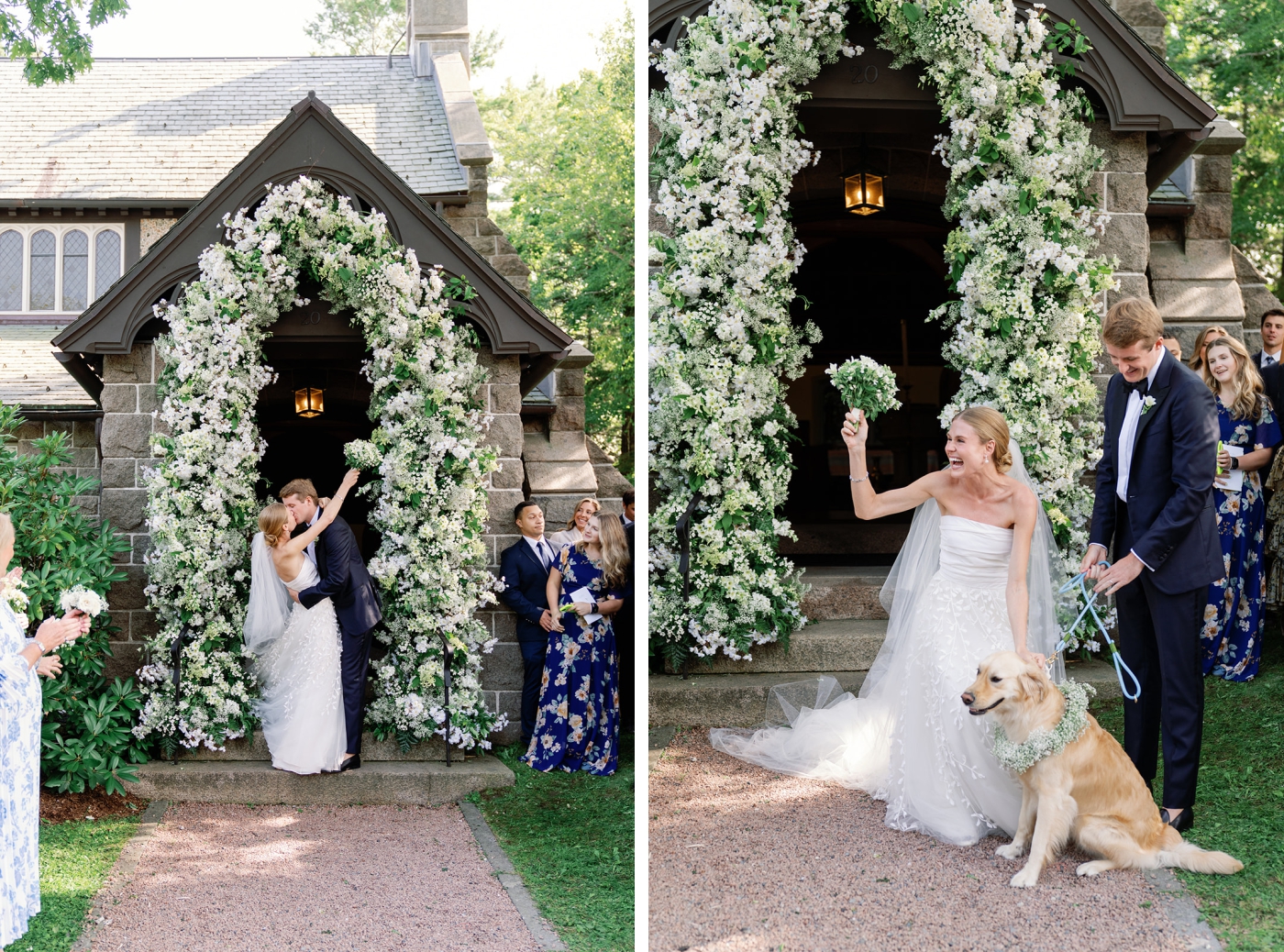 A bride and groom petting a golden retriever beneath a white floral arch 