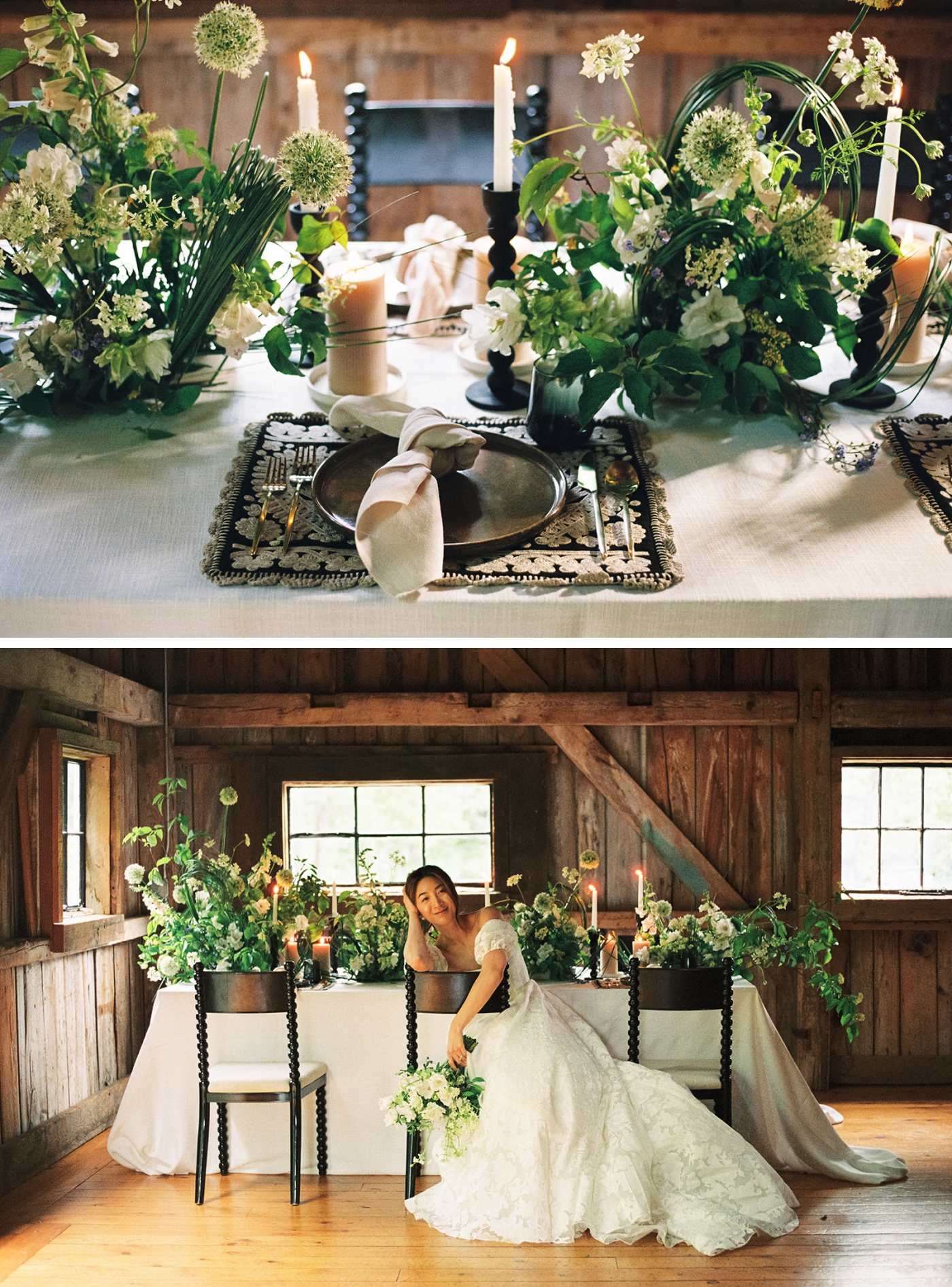A black plate on a black and white place mat surrounded by flowers and candles on a table inside a barn