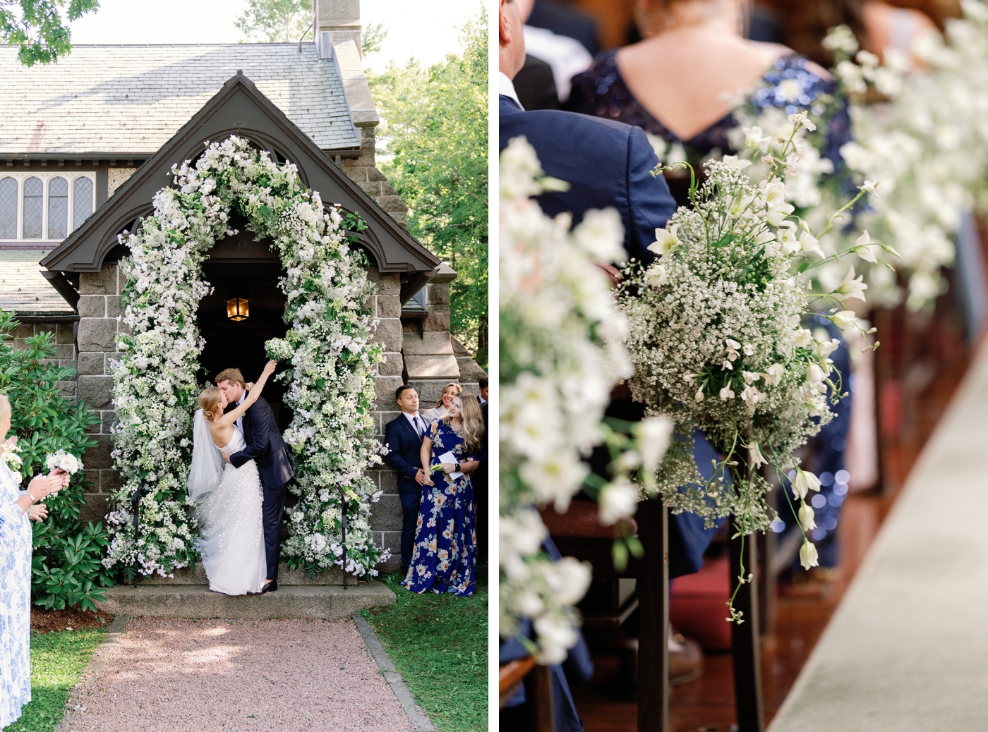 A bride and groom kiss beneath an arch of baby's breath flowers