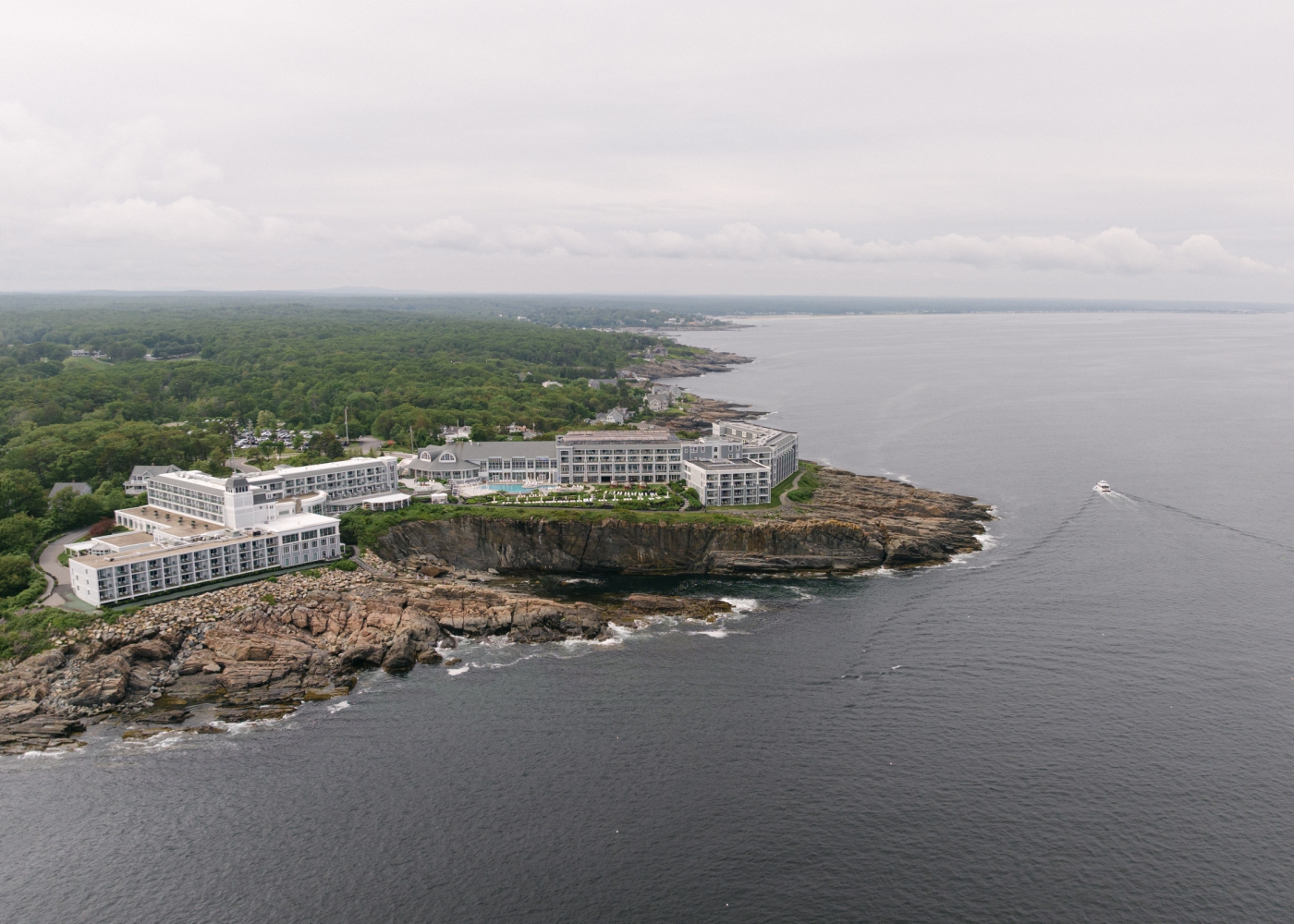 A drone shot of The Cliff House, a four-star hotel on the rocky shoreline of Maine