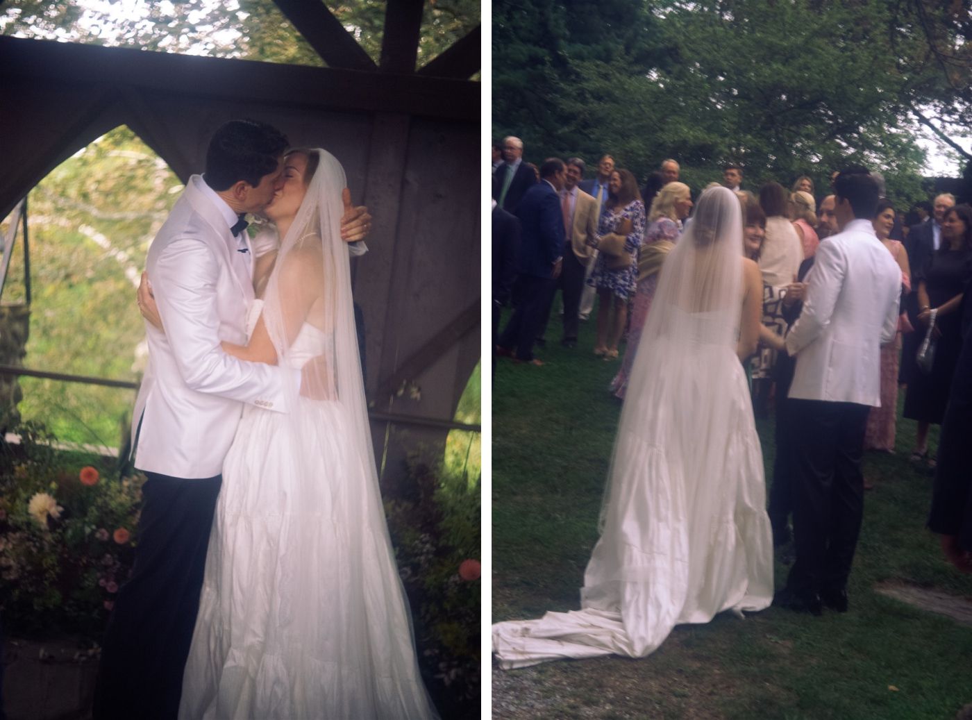 A bride in a silk dress kisses a groom in a white tuxedo jacket