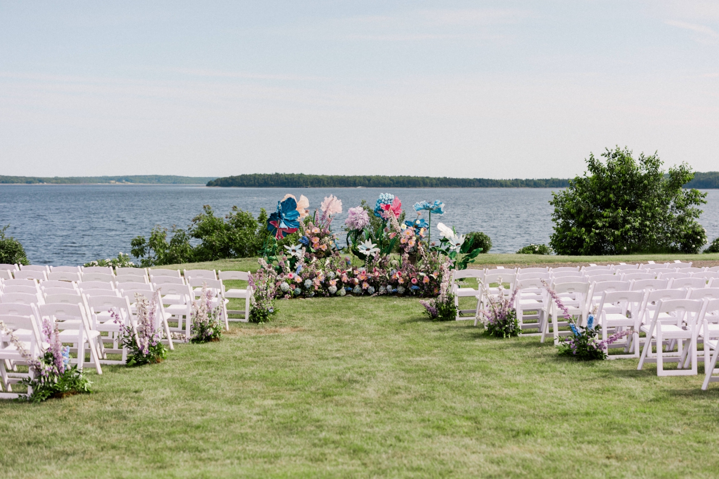 A floral altar installation with colorful paper and fresh blooms