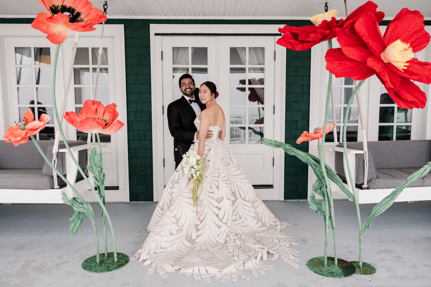 An Asian bride and an Indian groom in western wedding apparel