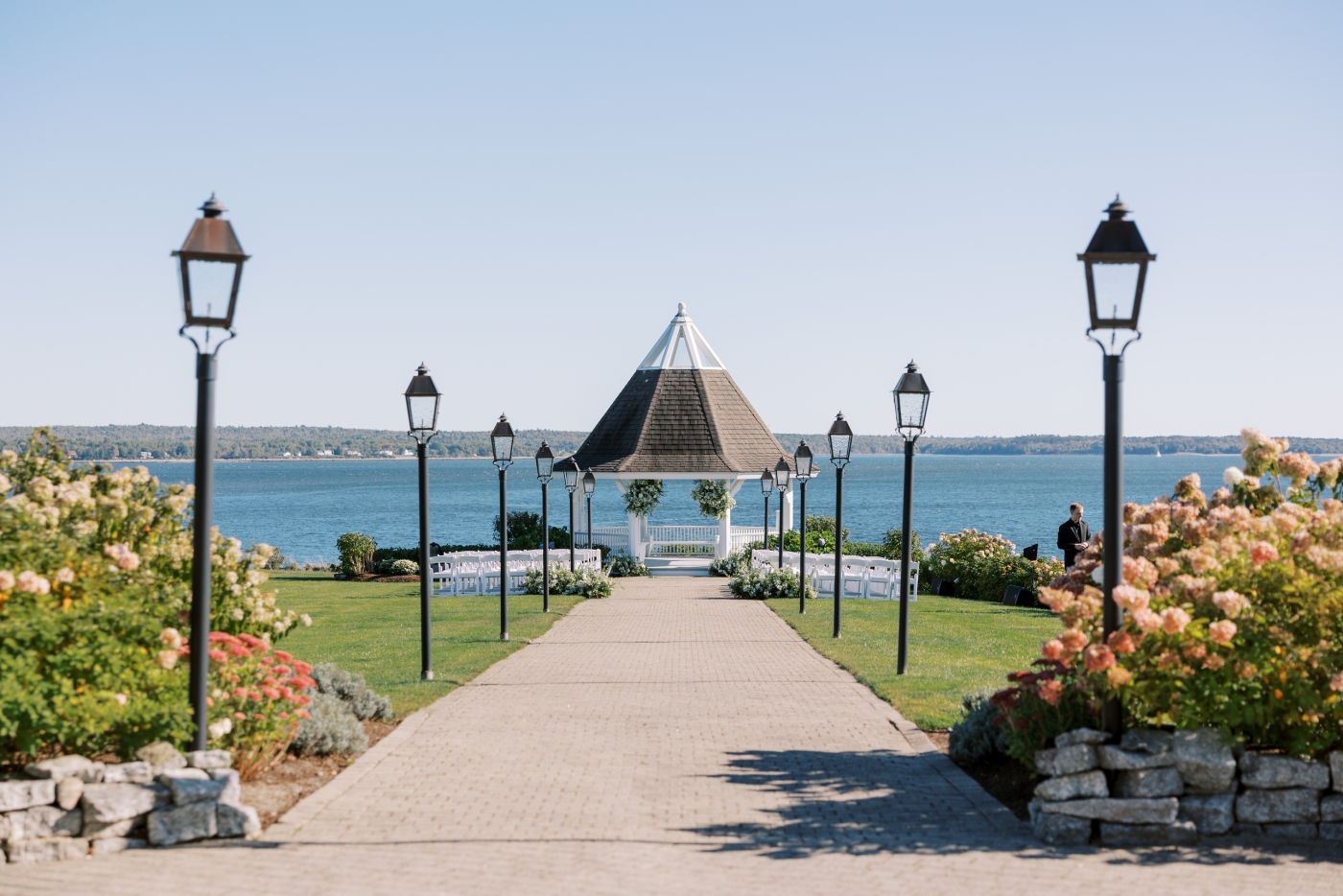 A brick walkway leading to a pavilion on the riverbank at French's Point
