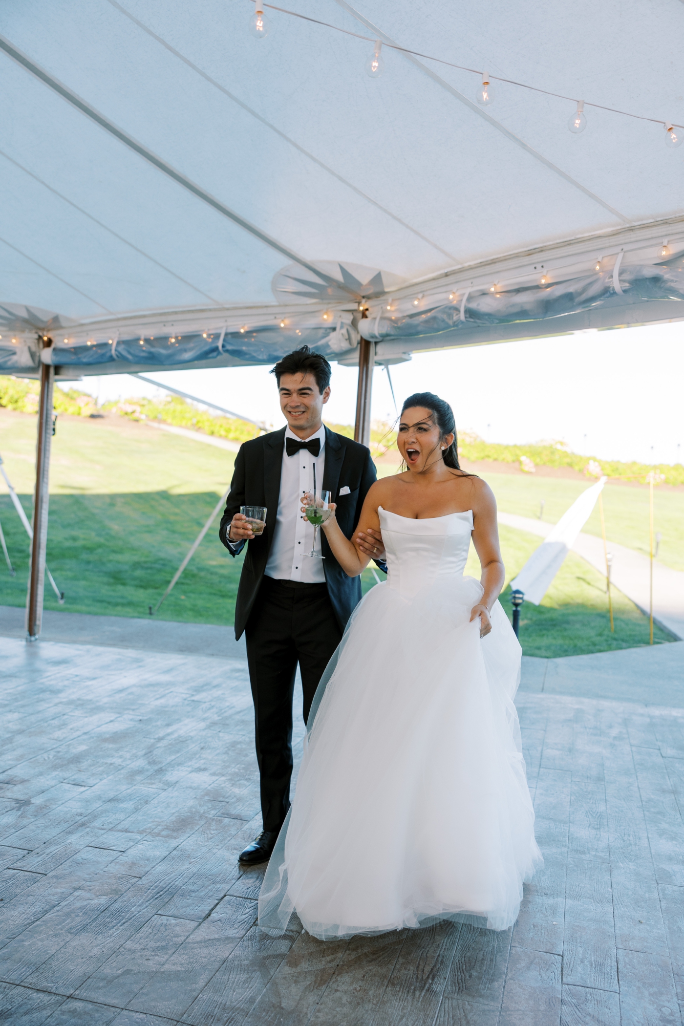 A bride and groom react to seeing their dream wedding reception