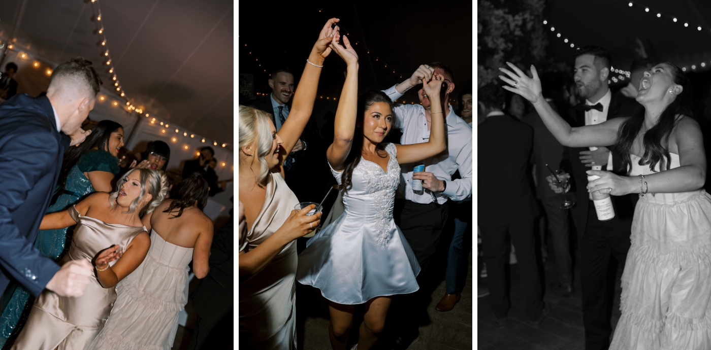 A bride in a short reception dress leads the groom onto the dancefloor